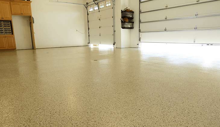 Finished gray flake-chip garage floor in a Reno home
