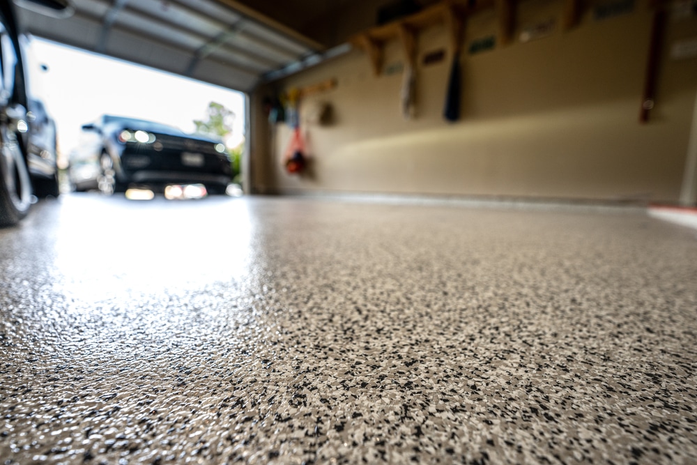 Glossy gray flake-chip coated garage floor with the Nevada foothills outside