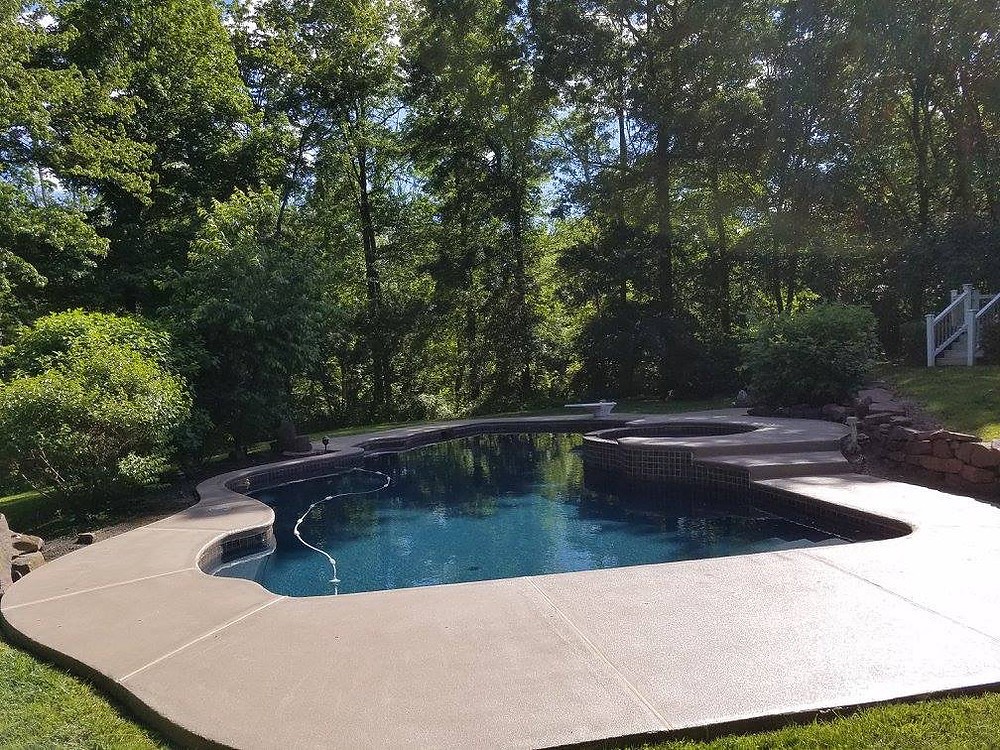 Same patio after a tan slip-resistant flake coating