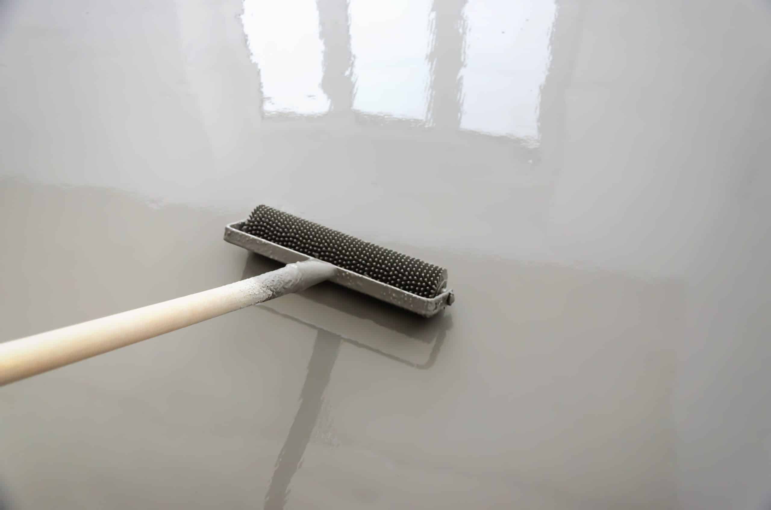 Squeegee spreading a fresh polyurea coat
