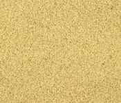 Close-up of uncooked couscous grains.