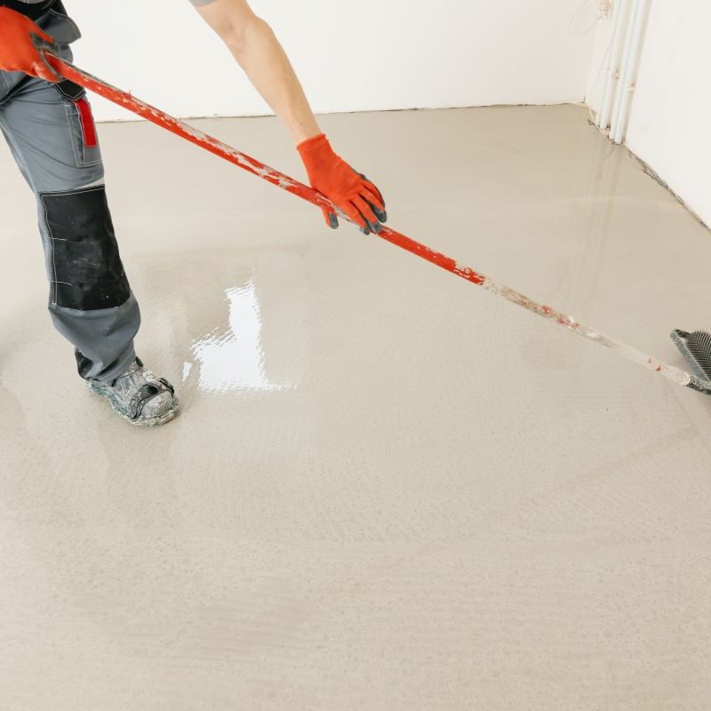 Worker applying needle roller to concrete coating in Reno, Nevada