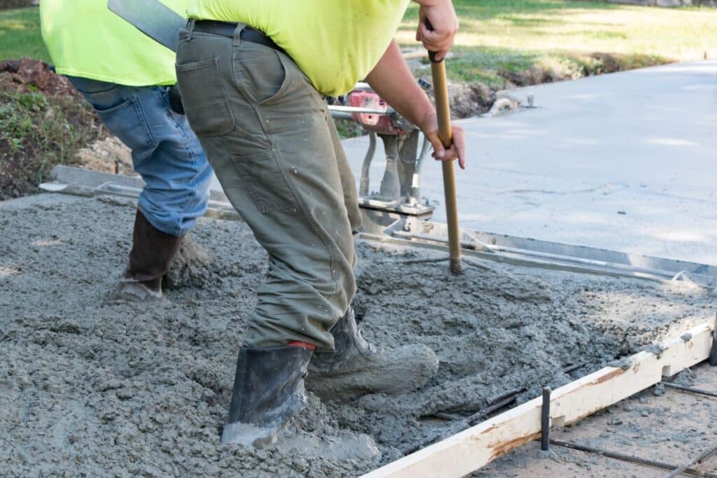 Workers finishing concrete slab on driveway in Reno, Nevada