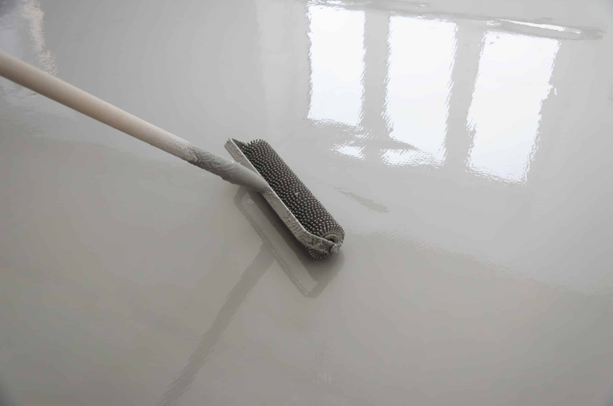 Applying self-leveling floor compound with roller
