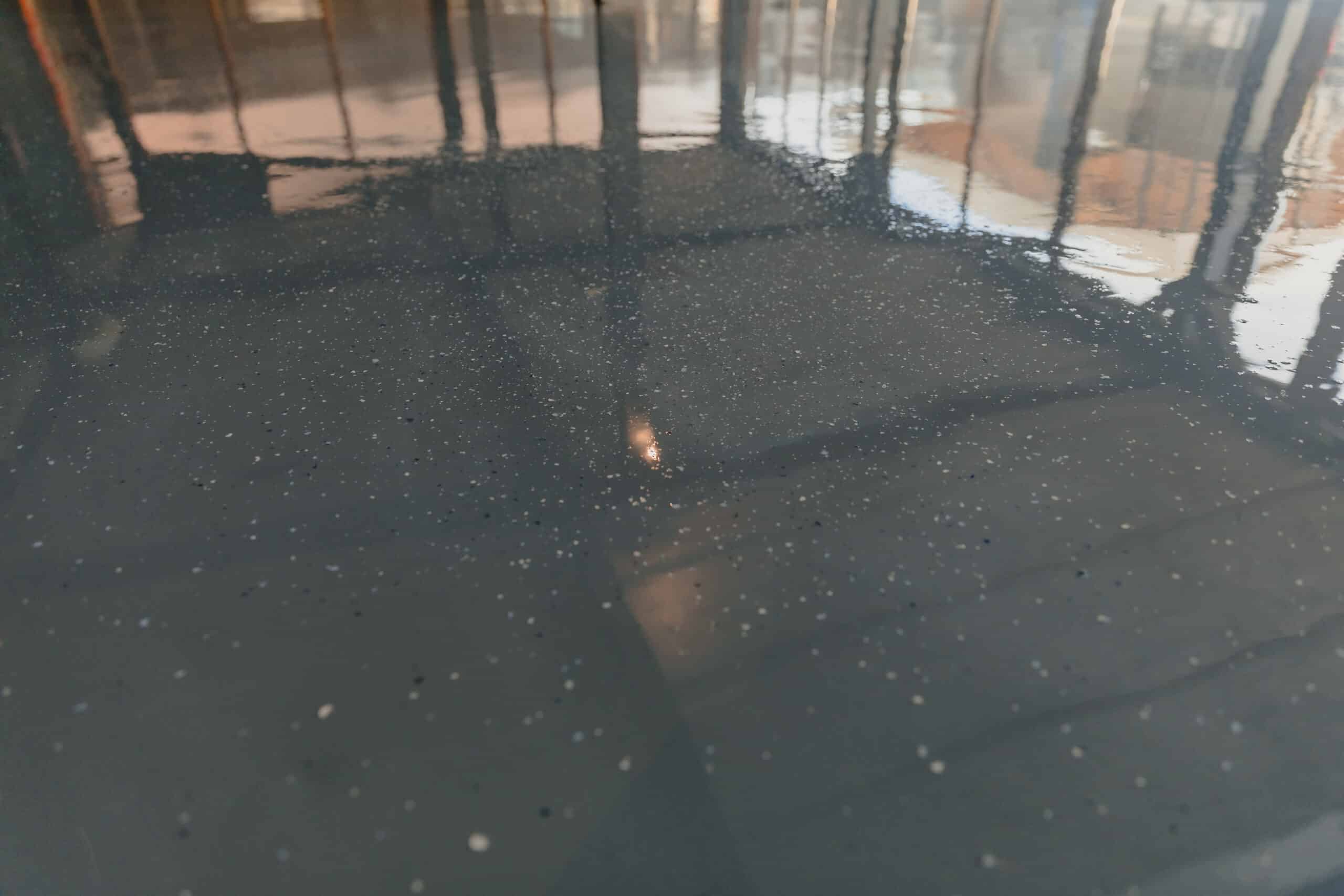 Close-up of shiny epoxy-coated floor surface.