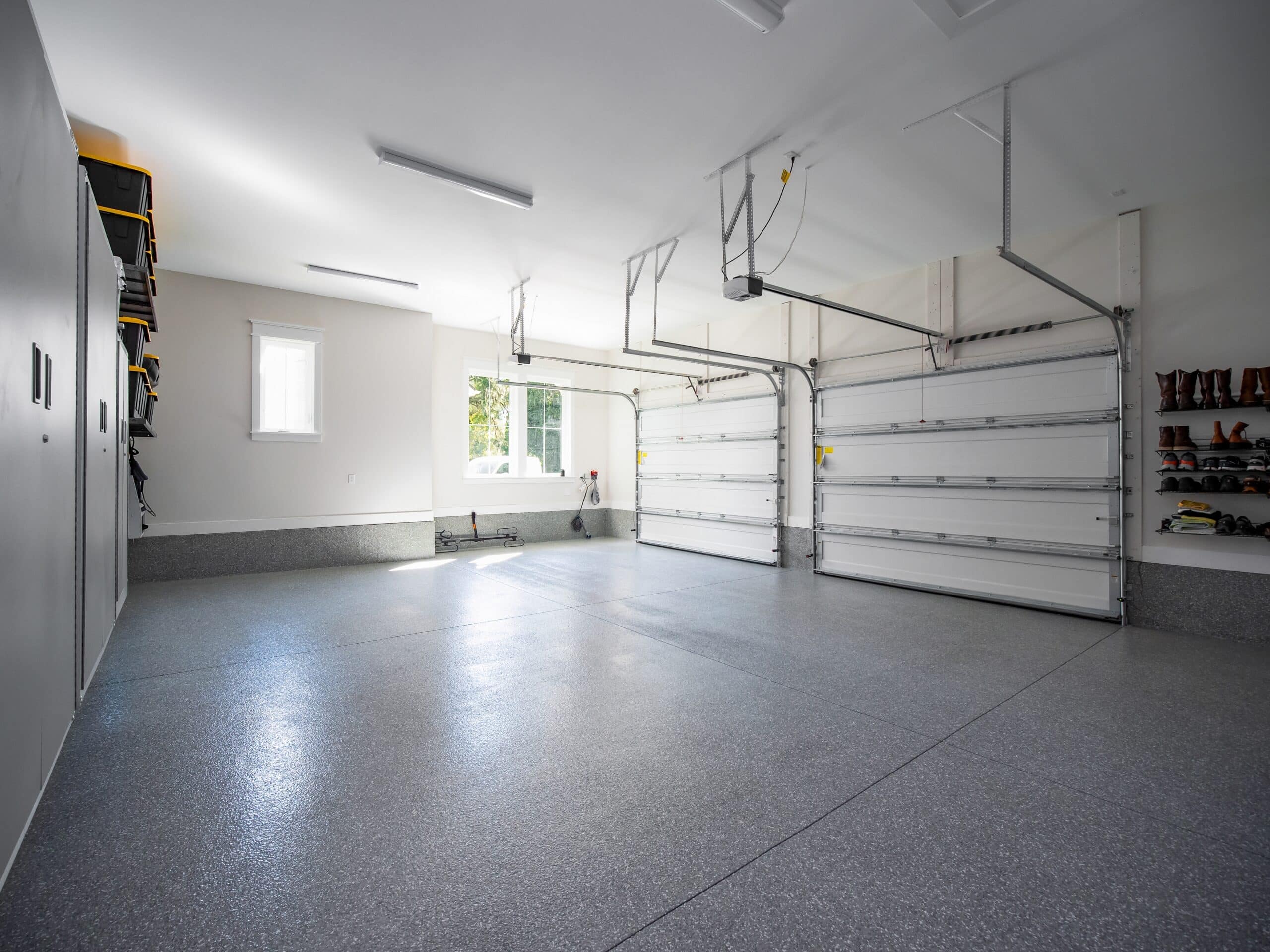 Spacious modern garage with storage and natural light.