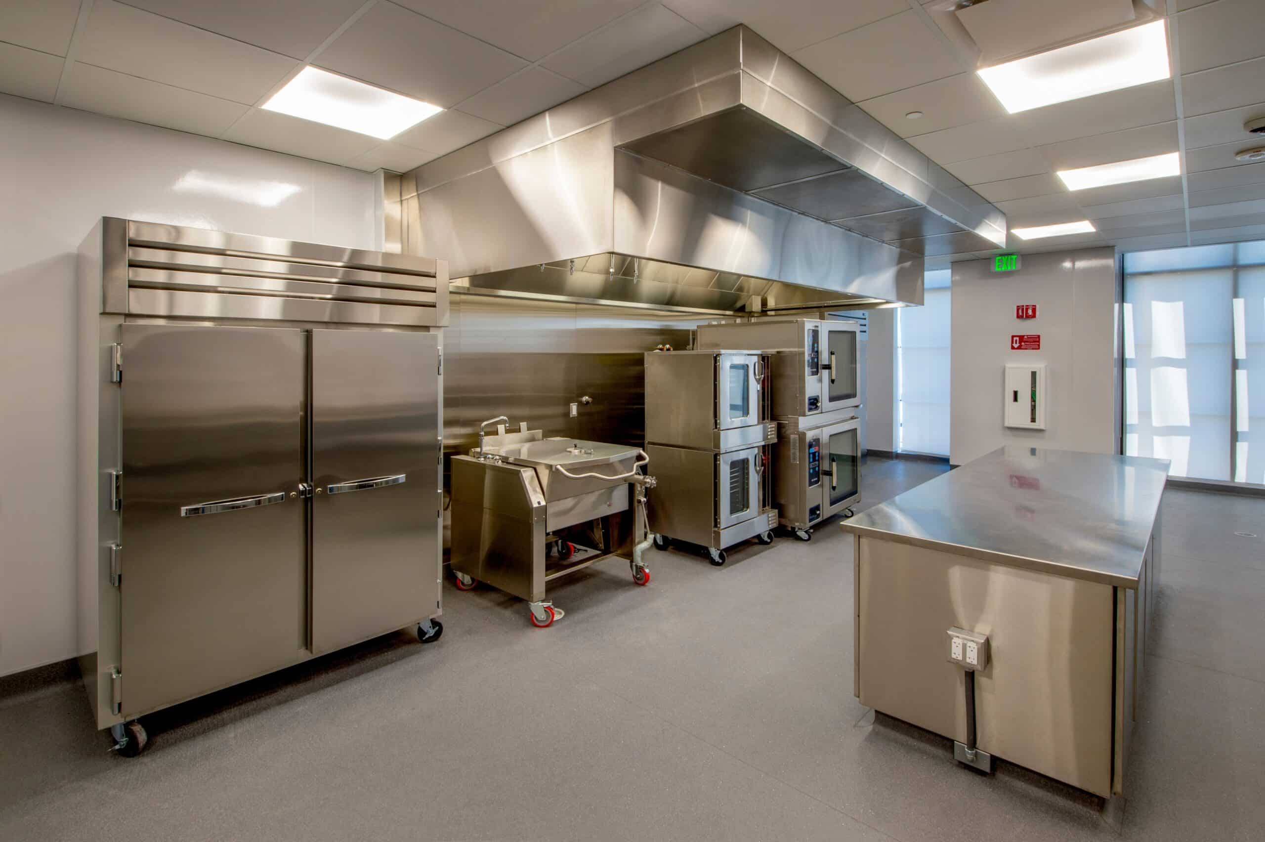 Modern stainless steel commercial kitchen interior.
